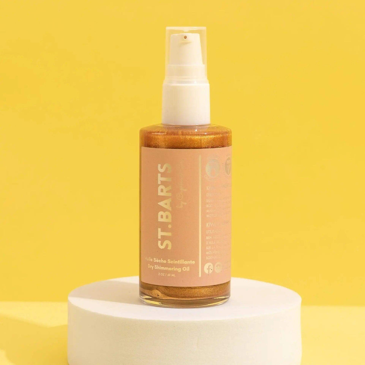 St.Barts Dry Shimmering Oil in bronze, 2 oz bottle, featuring kiwi, pineapple, and coconut scent for a radiant glow on all skin tones.