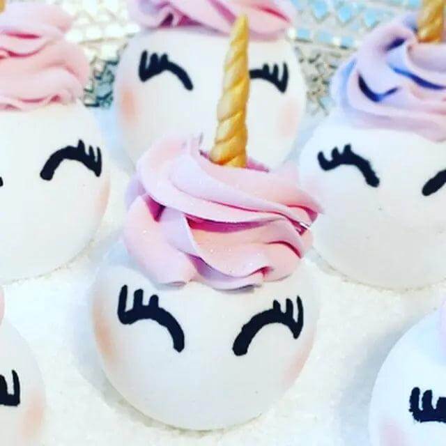 Colorful Uni-Bomb XL bath bombs shaped like unicorns, with swirl horn and floral fragrance, 8.5 oz for soothing skin care.