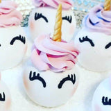 Colorful Uni-Bomb XL bath bombs shaped like unicorns, with swirl horn and floral fragrance, 8.5 oz for soothing skin care.