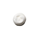 Volumizing mousse dollop showcasing lightweight, fluffy texture for hair styling.