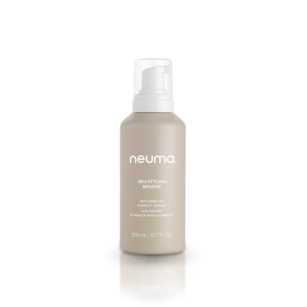 Neu Styling Mousse bottle enhancing volume and bounce with lavender, mandarin, and vanilla scent. Alcohol-free and non-aerosol formula.